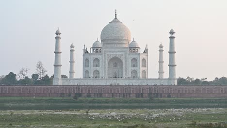 taj mahal view in sunset in overcast day in agra, india