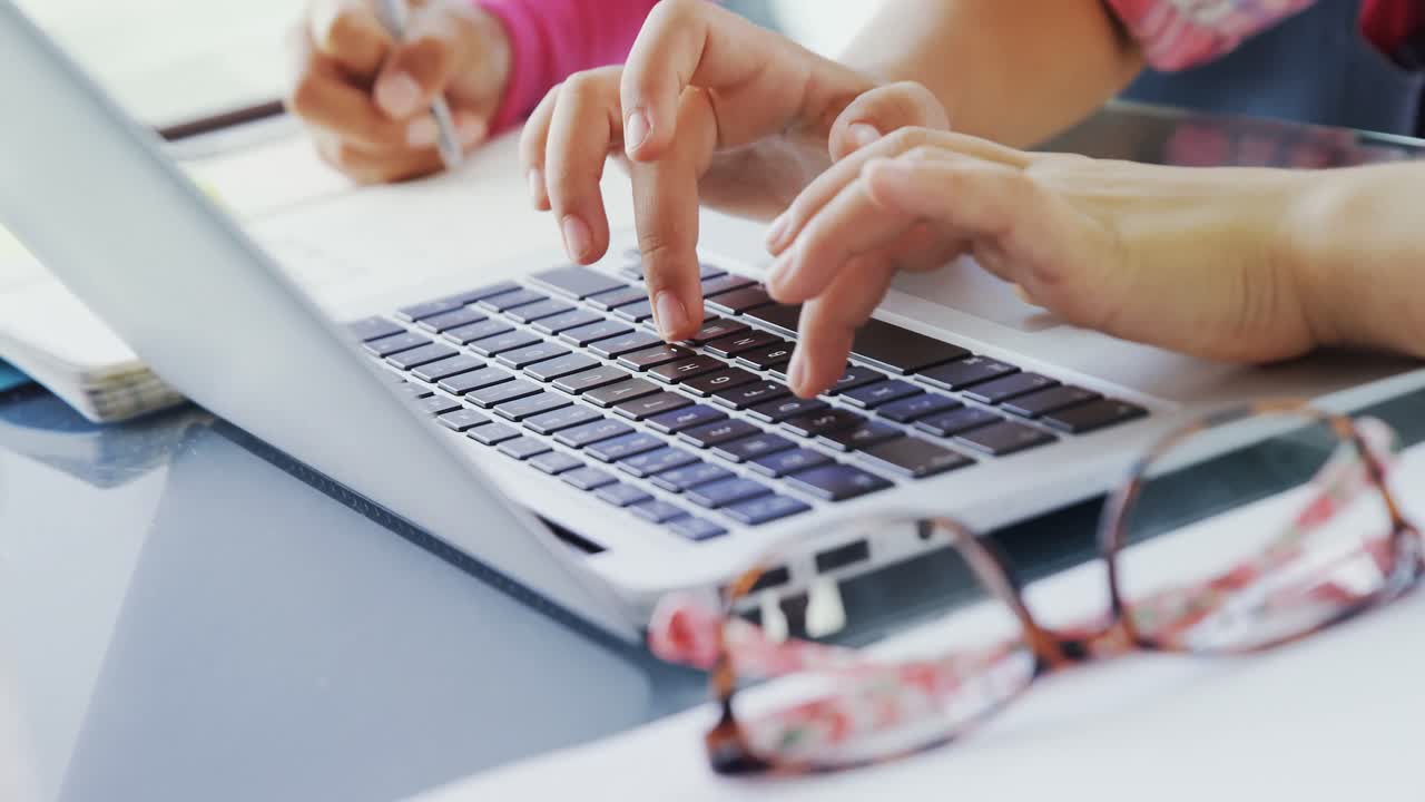 Kids as executives typing on laptop 4K 4k