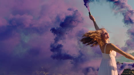 woman dancing with purple smoke bomb on beach celebrating creative expression with playful dance spin in slow motion