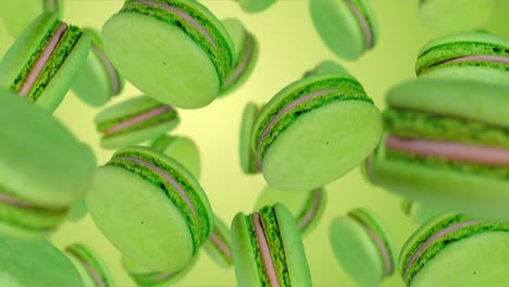 green macarons  falling down. slow motion