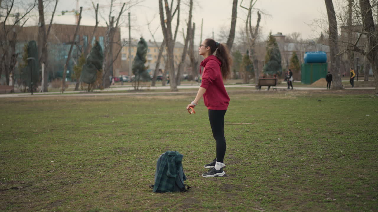 Full Body Woman Exercises In Nature Setting, Caucasian Woman Engages In Mindful Stretching During Sunrise, Woman Performs Controlled Warmup With Mindful Breathing In Peaceful Grassy Park