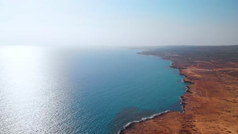 Aerial-shot-flying-over-the-rocky-coast-of-Cavo-Greko-in-Cyprus