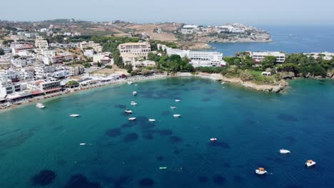 Agia-Pelagia-seaside-resort-and-bay-in-the-Greek-island-of-Crete,-aerial-view