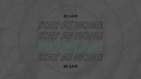 digital animation of stay at home text against concentric circles on grey background