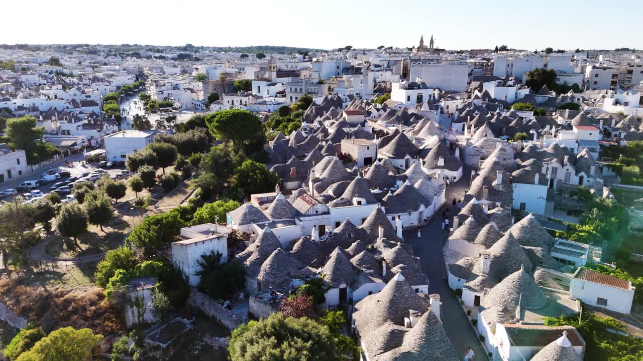 Trulli houses of Arbelobello city on sunny day, aerial drone view