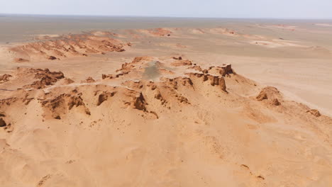 The-Flaming-Cliffs-In-The-Gobi-Desert-In-Mongolia-At-Daytime---Aerial-Shot