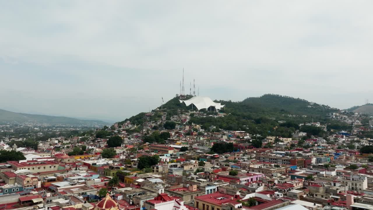 DRONE: DOLLY IN BETWEEN THE TREES OF GUELAGUETZA STADIUM IN OAXACA