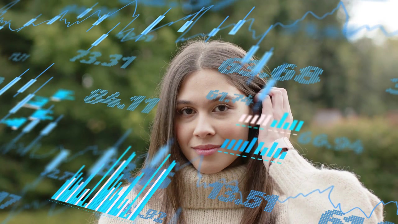 Woman raising right hand and brushing hair in garden engaging with floating financial charts