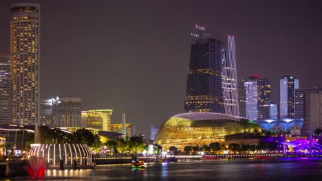 night time illuminated singapore downtown marina bay traffic famous esplanade panorama timelapse 4k