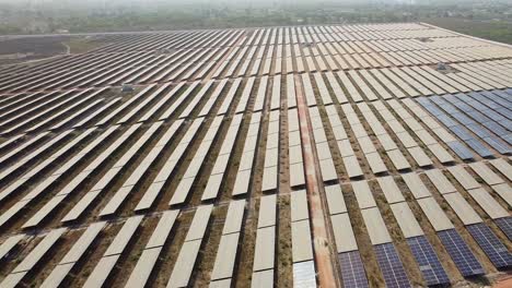 aerial view of new solar panels at photovoltaic power plant under construction. renewable electric energy