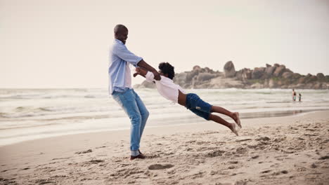black family, beach and a father spinning his son