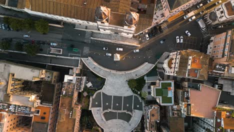 cars drive past trinita dei monti at spanish steps in rome, italy