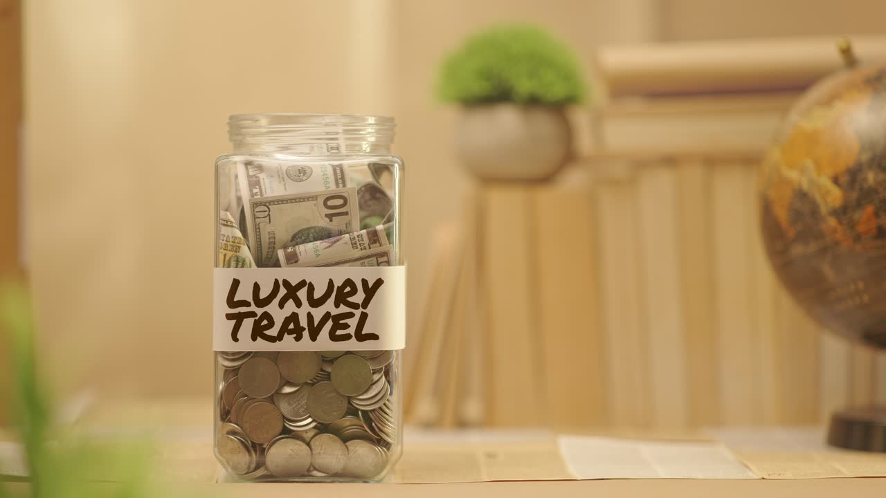 PERSON SAVING MONEY FOR LUXURY TRAVEL