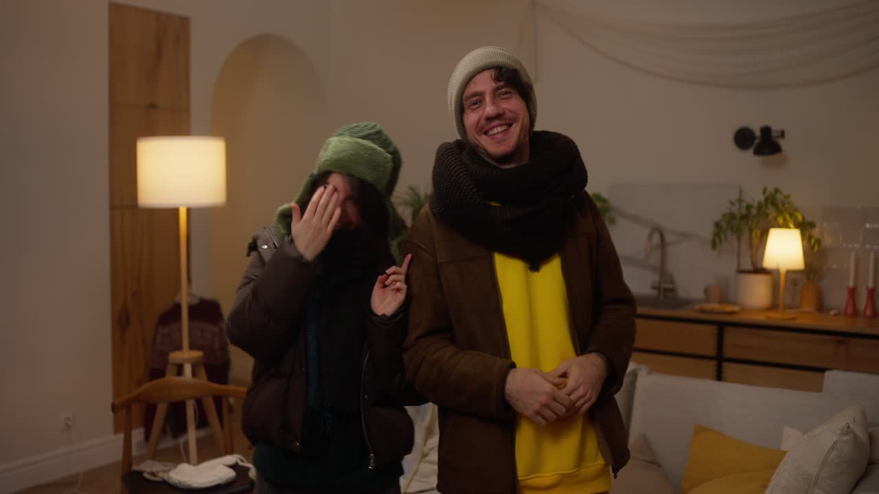 Couple enjoying a cozy winter evening at home