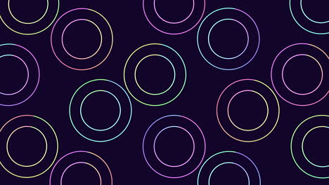 los círculos coloridos crean un patrón sin costuras en un fondo oscuro.
