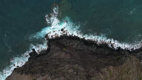 ocean waves crash on molokai, hawaii shoreline