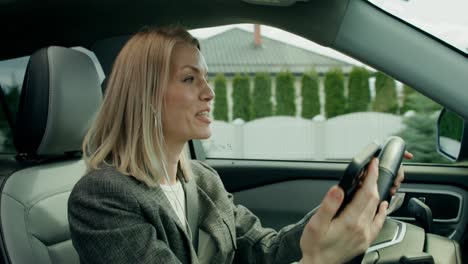 woman driving a car and listening to music