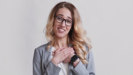 happy woman in a gray blazer