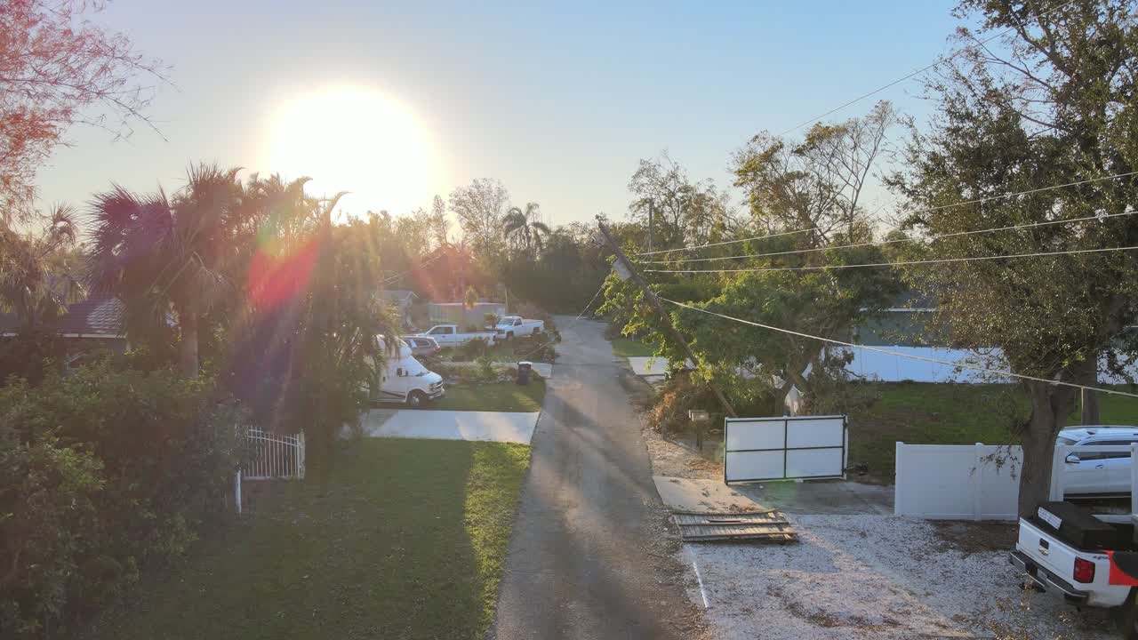 Hurricane Aftermath: Residential Street with Extensive Tree and Power Line Damage