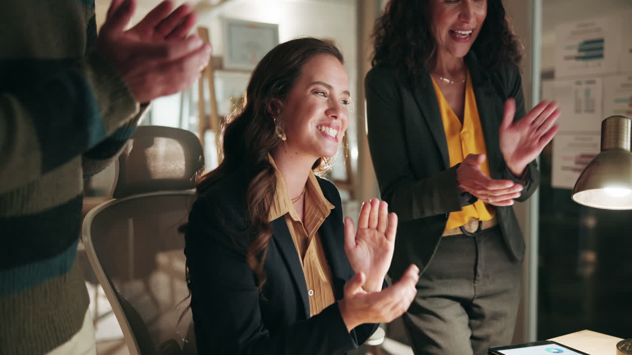 Colleagues Clapping and Celebrating Success in the Office