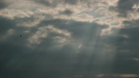 sunbeams burst through clouds