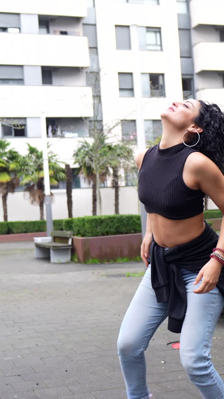 Woman dancing in an urban environment