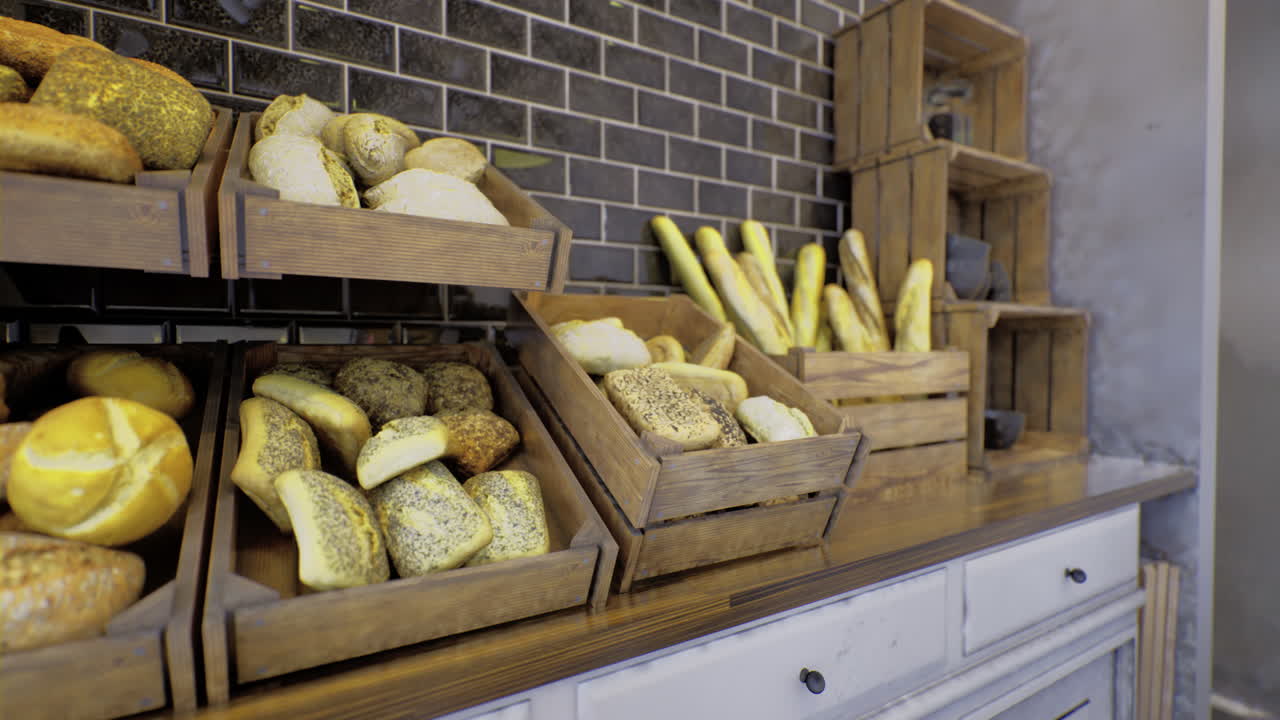 Freshly baked loaves and artisanal bread displayed in rustic wooden crates