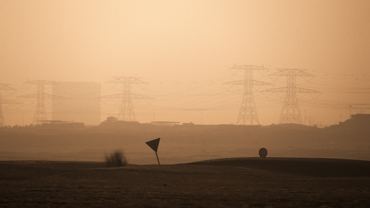 Desert Landscape at Sunrise/Sunset with Power Lines and Golf Course