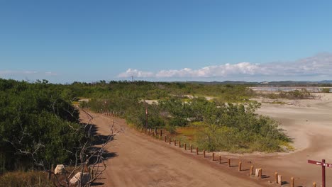 drone lift off and revealing the salt lake in cabo rojo puerto rico near the faro los morillos