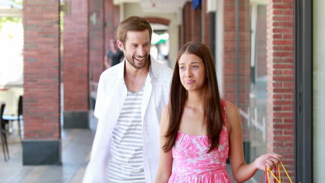 happy couple shopping together in the mall