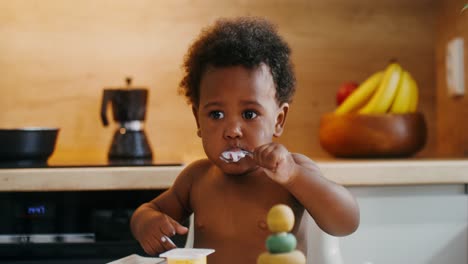 baby eating yogurt