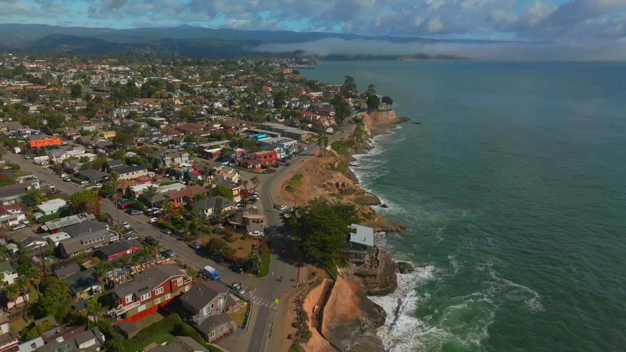 Aerial View of Coastal Town with Ocean and Houses