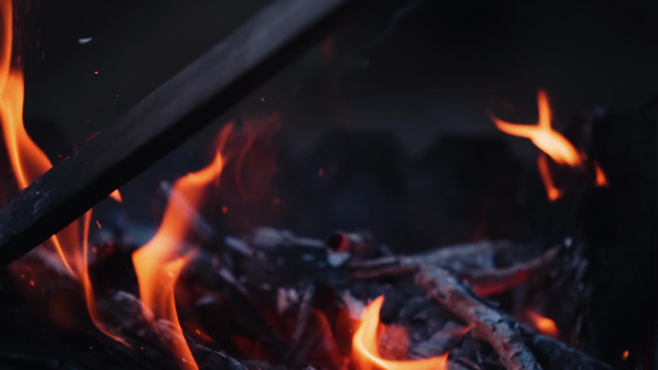 Bonfire. Burning logs in orange flames. Beautiful fire burns brightly. Slow motion