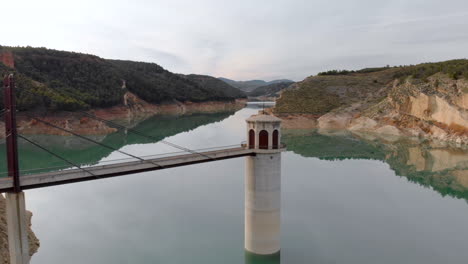 Amazing-drone-aerial-pullback-reveal-reservoir-Francisco-Abellan-water-to-dam