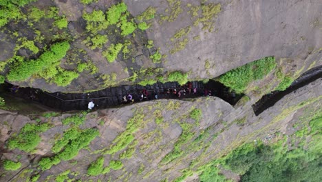 Aerial-view-of-the-crowd-of-Hindu-devotees-hiking-up-to-Brahmagiri-mountain-in-Trimbakeshwar-during-the-holy-month-of-Shravana,-Nashik,-Maharashtra,-India