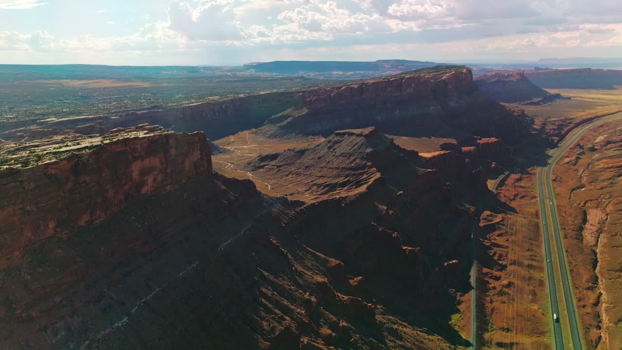 Sunlit cliffs and rocks of Zion National park at daytime. Amazing scenery of deserted territory from top view.