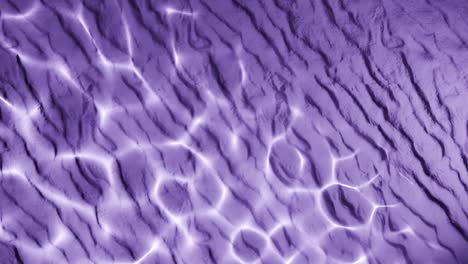 water reflection light pattern on wrinkled purple sand surface. abstract natural overlay with wavy lines and sunlight ripple effect. design for wallpaper, banner, postcard, greeting card, poster,