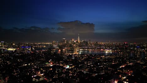 New-York-City-Night-Lights,-Sunset-over-Brooklyn-Rooftops-and-Manhattan