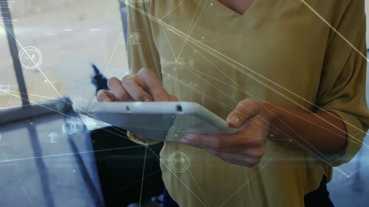 Animation of data processing over biracial businesswoman using tablet