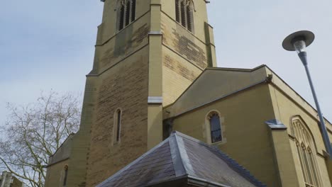 handheld tilt up reveals gorgeous turret architecture of english building