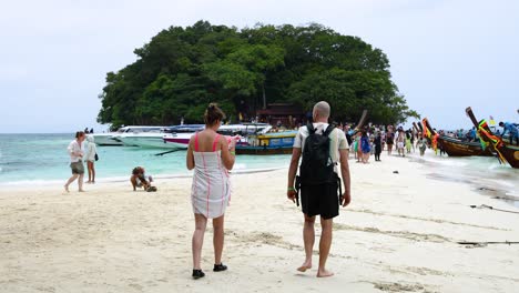 tropical island beach with tourists