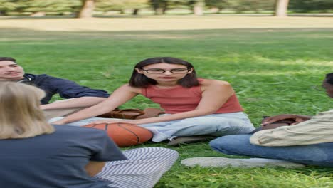 group of friends discussing in a park