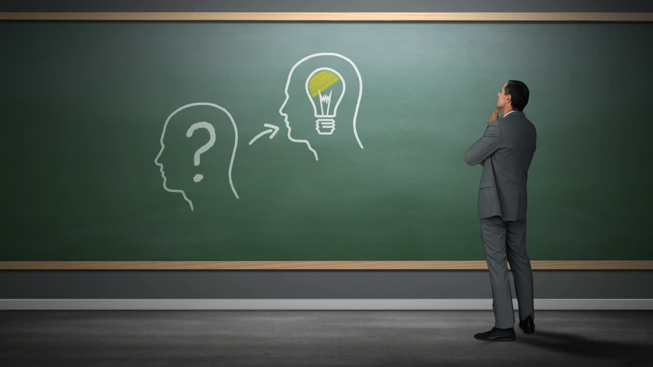 Uomo d'affari che guarda teste umane