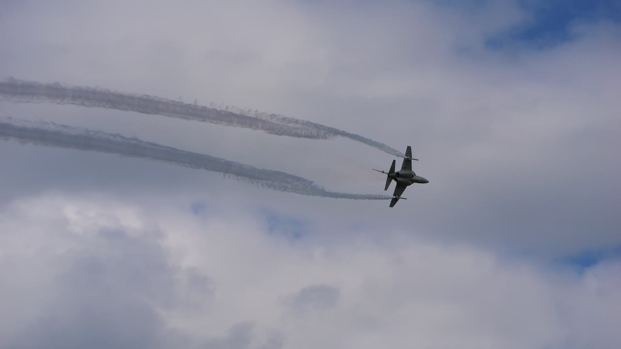 Military aircraft of the type Alenia Aermacchi T 346 flies through the air in slow motion at the airshow called Airpower
