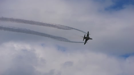 military aircraft of the type alenia aermacchi t 346 flies through the air in slow motion at the airshow called airpower