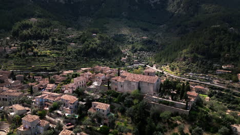 aerial view of deia village nestled in mallorca's mountains