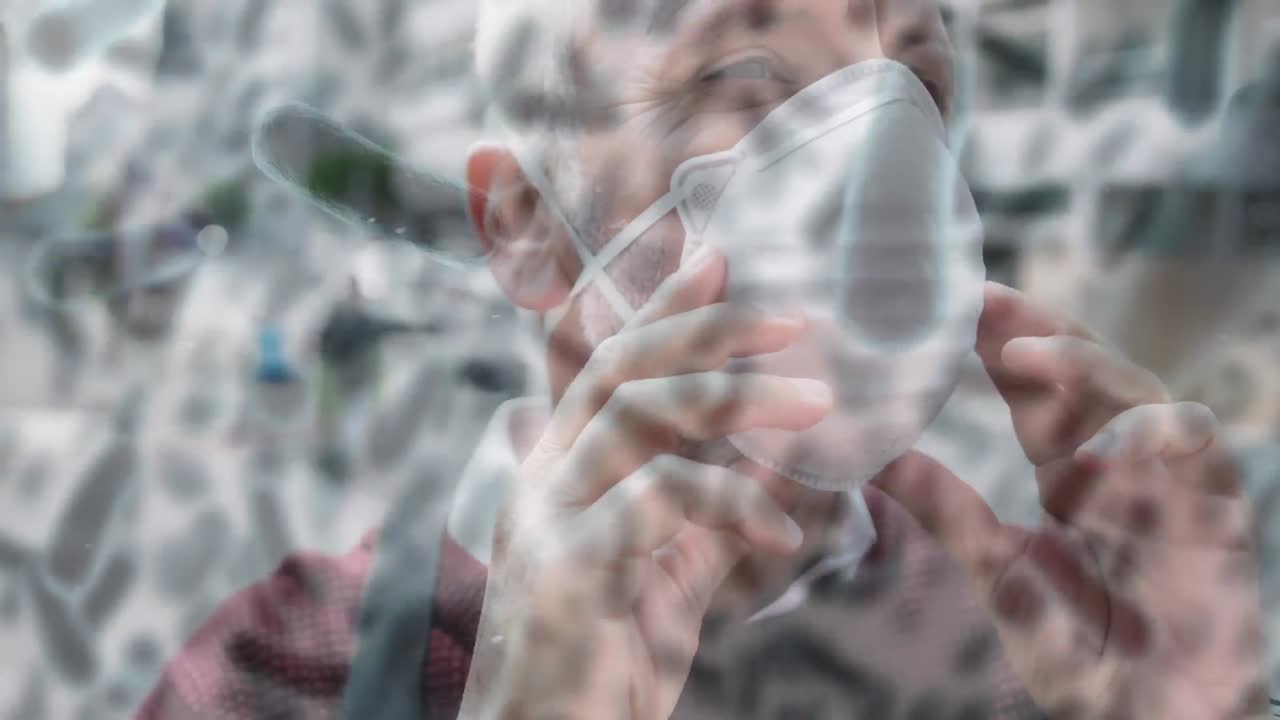 코로나19 세포가 얼굴 마스크를 쓰고 있는 사람을 가로질러 움직이는 애니메이션