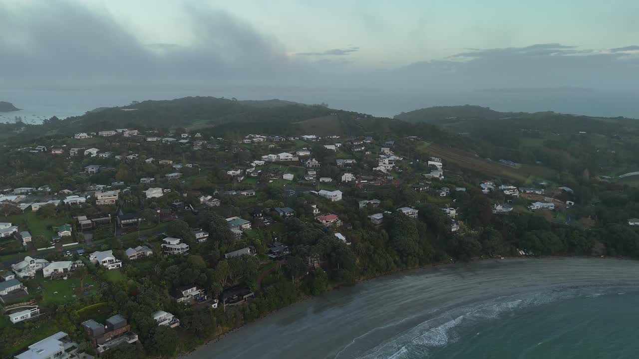 Aerial view of Oneroa Bay on Waiheke Island, New Zealand on a cloudy day.