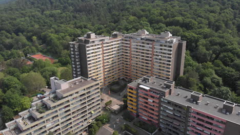 apartment building with green forest behind, heidelberg, germany