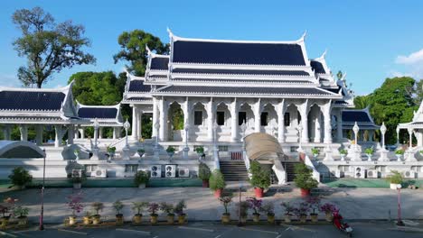 serene traditional thai temple complex, tropical landscape